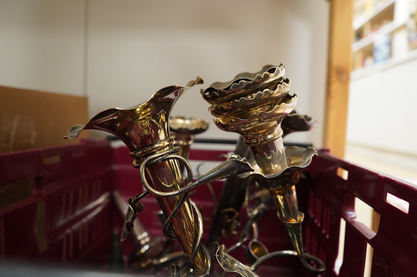 Three silver plated epergnes to include a naturalistic example decorated with leaves and vines